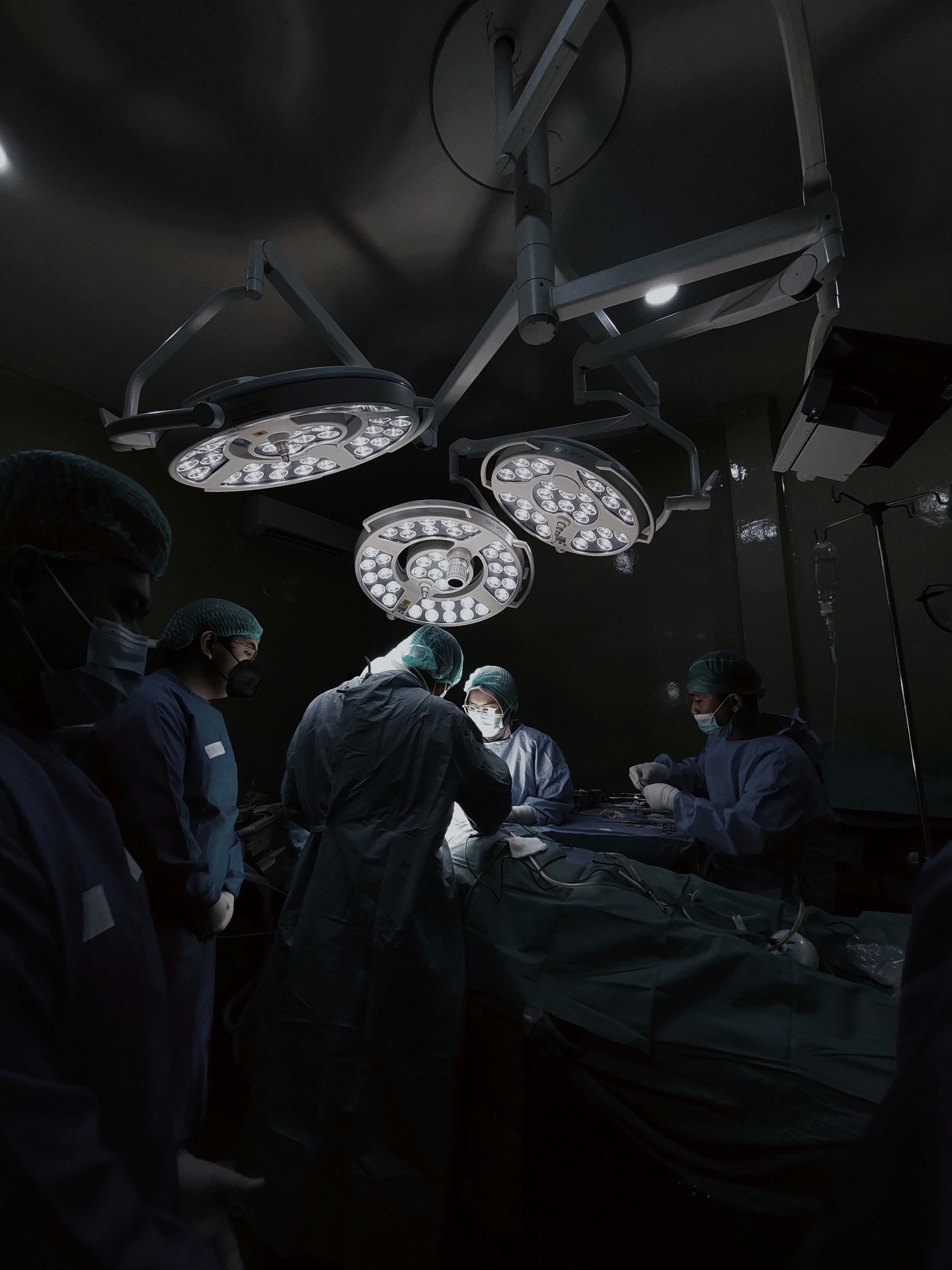 Surgeons performing an operation in a modern operating theatre